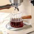 Casora mini glass coffee cup with wooden handle filled with coffee