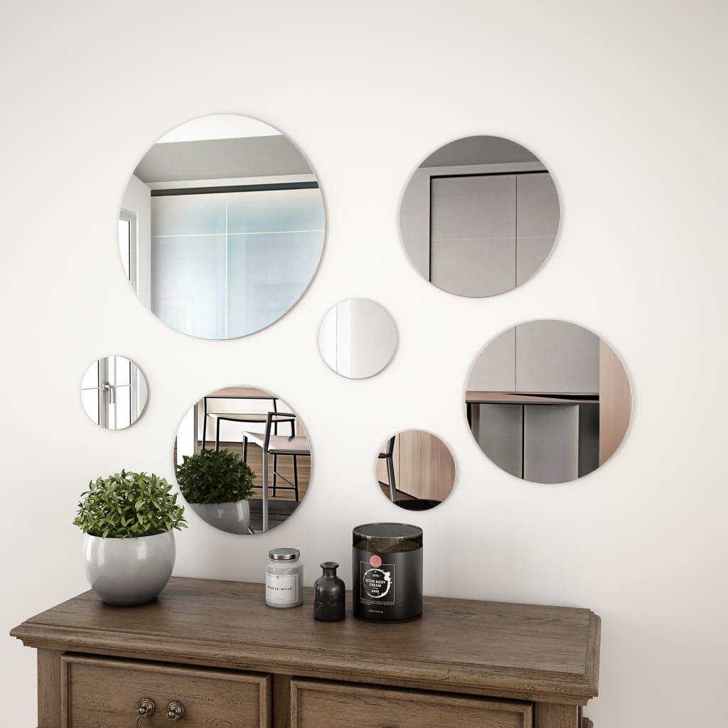 7-piece round frameless wall mirror set arranged on a wall