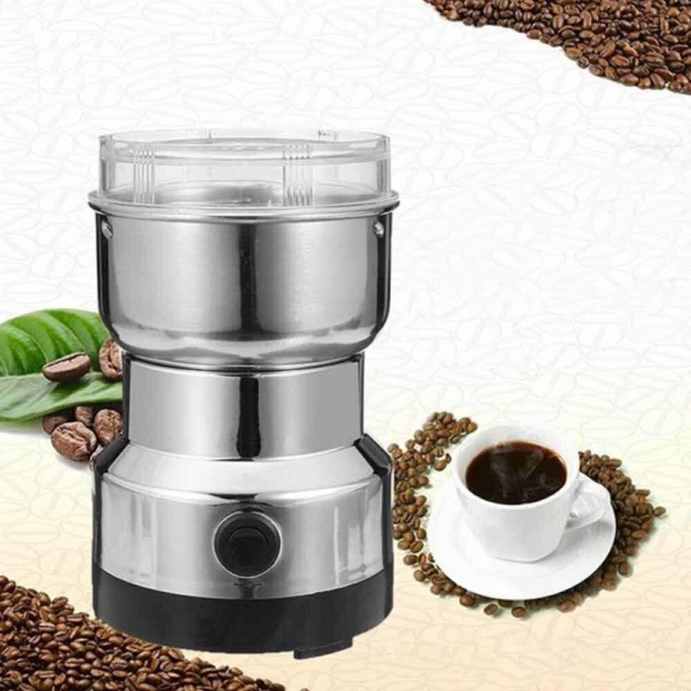 Electric coffee grinder with transparent lid removed showing stainless steel bowl