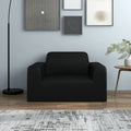 Casora black stretch cover fitted on a 1-seater armchair