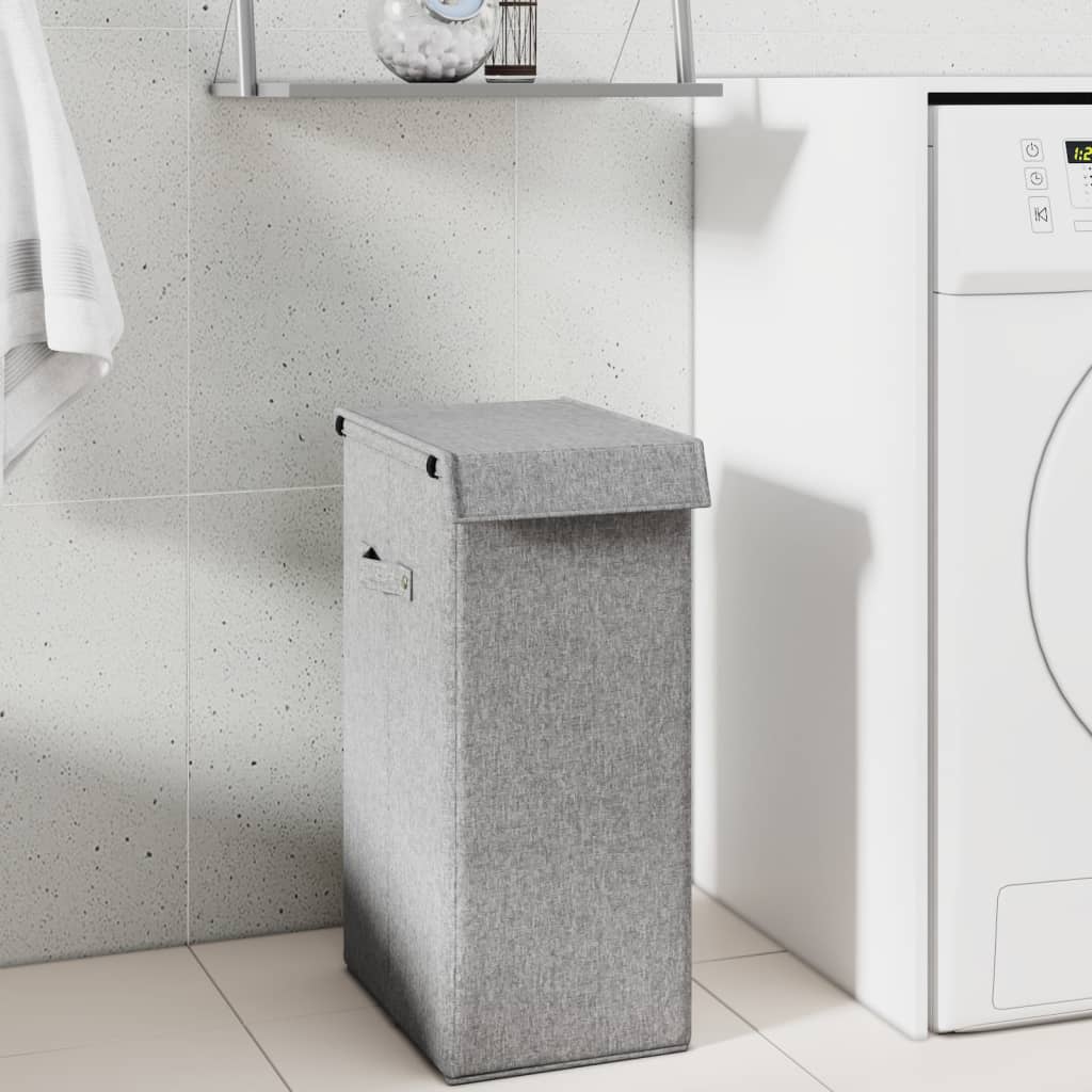 Grey foldable laundry basket next to washing machine in bathroom