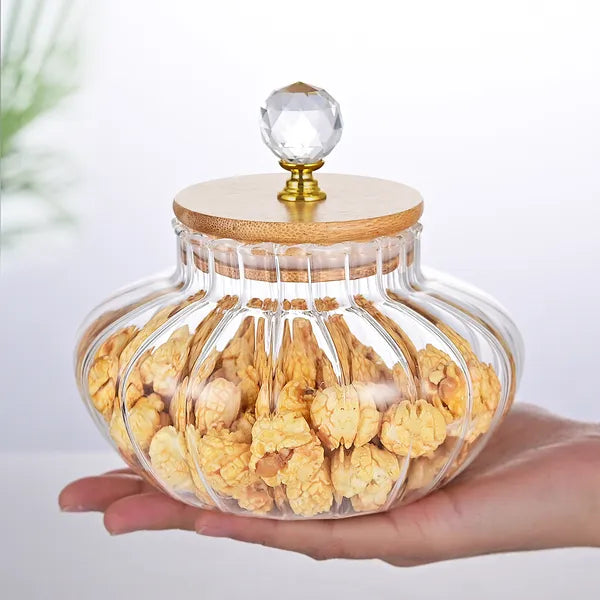 Glass storage jar with lid removed showing opening