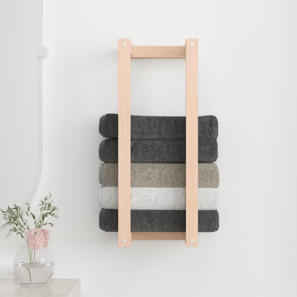 Wooden towel rack mounted on bathroom wall
