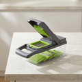 Casora 16-in-1 vegetable slicer set with blade inserts on a stone counter